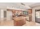 Kitchen featuring granite countertops, stainless steel appliances, and backyard access at 662 W Laguna Azul Ave, Mesa, AZ 85210
