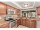 Updated kitchen with granite countertops and stainless steel appliances at 662 W Laguna Azul Ave, Mesa, AZ 85210