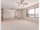 Spacious living room featuring carpet floors, neutral walls, and great natural light at 662 W Laguna Azul Ave, Mesa, AZ 85210