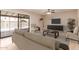 Comfortable living room with a view of the pool area and modern decor at 662 W Laguna Azul Ave, Mesa, AZ 85210