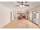 Open living space featuring tile floors, adjoining kitchen and outdoor access at 662 W Laguna Azul Ave, Mesa, AZ 85210