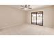 The main bedroom features neutral walls, carpet, and sliding door access to backyard pool at 662 W Laguna Azul Ave, Mesa, AZ 85210