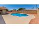 Private in-ground pool is surrounded by a spacious patio and a secure fence for peace of mind at 662 W Laguna Azul Ave, Mesa, AZ 85210