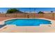Inviting in-ground pool with a clean, refreshing appearance, surrounded by a patio area, ideal for relaxing at 662 W Laguna Azul Ave, Mesa, AZ 85210