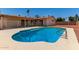 Lush backyard featuring a fenced-in pool, offering a private and secure oasis for leisure and recreation at 662 W Laguna Azul Ave, Mesa, AZ 85210