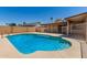 Backyard pool features a cool blue hue, complemented by a surrounding patio and enclosed for added safety at 662 W Laguna Azul Ave, Mesa, AZ 85210