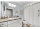 Cozy bathroom featuring a granite-topped vanity, ample storage, and a separate shower space at 6803 E Main St # 5506, Scottsdale, AZ 85251