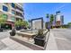 Modern water feature and lush landscaping complement the building's contemporary design at 6803 E Main St # 5506, Scottsdale, AZ 85251