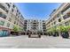 Exterior courtyard with fountain and manicured landscaping under a clear sky at 6803 E Main St # 5506, Scottsdale, AZ 85251