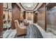 Hallway with stylish seating and elevator access creating a sophisticated ambiance at 6803 E Main St # 5506, Scottsdale, AZ 85251