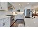 Bright kitchen features white cabinets, stainless steel appliances, and quartz countertops at 6803 E Main St # 5506, Scottsdale, AZ 85251