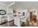 Modern kitchen with white cabinetry, stainless steel appliances, and island seating at 6803 E Main St # 5506, Scottsdale, AZ 85251