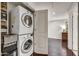 This laundry area features stacked washer and dryer, with shelving and storage solutions for added convenience at 6803 E Main St # 5506, Scottsdale, AZ 85251