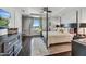 Stylishly appointed main bedroom boasting a four-poster bed, hardwood floors, and a bright window view at 6803 E Main St # 5506, Scottsdale, AZ 85251