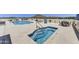 This rooftop pool and hot tub offer a refreshing escape with lounge chairs, and a mountain view backdrop at 6803 E Main St # 5506, Scottsdale, AZ 85251