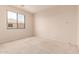 Neutral bedroom with a large window providing natural light at 7418 S 25Th Ln, Phoenix, AZ 85041