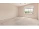Bedroom with a ceiling fan and a large window for natural light at 7418 S 25Th Ln, Phoenix, AZ 85041