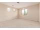 Bedroom with multiple windows provides ample natural light at 7418 S 25Th Ln, Phoenix, AZ 85041
