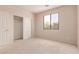 Bedroom features closet space and a window for natural light at 7418 S 25Th Ln, Phoenix, AZ 85041