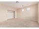 Bedroom with a closet and multiple windows for natural light at 7418 S 25Th Ln, Phoenix, AZ 85041