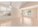 Bright living room with neutral walls, tile floor, and lots of natural light from the large windows at 7418 S 25Th Ln, Phoenix, AZ 85041