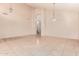 Spacious living room with soaring ceilings, decorative tile accents, and plenty of natural light at 7418 S 25Th Ln, Phoenix, AZ 85041