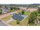 Aerial view of home, showcasing spacious lot with private pool, mature trees, and neighborhood views at 802 E Harwell Rd, Gilbert, AZ 85234