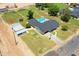 Aerial view of home with pool, large yard, additional buildings, and surrounding neighborhood at 802 E Harwell Rd, Gilbert, AZ 85234