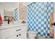 Charming bathroom with a checkered shower curtain and a bright, playful atmosphere at 802 E Harwell Rd, Gilbert, AZ 85234