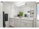 Spacious bathroom with double sinks, white cabinets, and a contemporary design at 802 E Harwell Rd, Gilbert, AZ 85234
