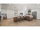 Bright kitchen featuring an oversized island with barstool seating, modern appliances, and custom cabinetry at 802 E Harwell Rd, Gilbert, AZ 85234