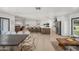 Open-concept kitchen features a large island with seating that flows to the dining and living spaces at 802 E Harwell Rd, Gilbert, AZ 85234