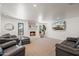 Comfortable living room with a cozy fireplace, plush seating, and a bright, welcoming atmosphere at 802 E Harwell Rd, Gilbert, AZ 85234