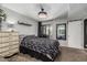 Bright bedroom featuring plush carpet, a ceiling fan, and an attached bathroom entrance for added convenience at 850 S River Dr # 2065, Tempe, AZ 85281