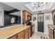 This kitchen offers wood cabinets, a stainless sink, and unique lighting, perfect for a modern living space at 850 S River Dr # 2065, Tempe, AZ 85281