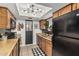 This kitchen offers wood cabinets, a stainless sink, and unique lighting, perfect for a modern living space at 850 S River Dr # 2065, Tempe, AZ 85281
