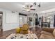 Bright living room featuring a cozy chair and a view into dining and kitchen areas at 850 S River Dr # 2065, Tempe, AZ 85281