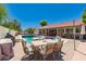 Relaxing backyard with a covered patio, swimming pool, and outdoor seating area at 930 N Sandal Cir, Mesa, AZ 85205