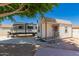Backyard features an accessory building with a porch, and parking for a travel trailer at 930 N Sandal Cir, Mesa, AZ 85205
