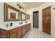 Primary bathroom features dual sinks, and walk-in shower at 930 N Sandal Cir, Mesa, AZ 85205