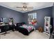 Comfortable bedroom features natural light, ceiling fan, and ample space at 930 N Sandal Cir, Mesa, AZ 85205