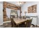 Charming dining area with rustic wood wall and ample seating, perfect for Gathering gatherings at 930 N Sandal Cir, Mesa, AZ 85205