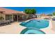 Beautiful backyard with a large swimming pool, and covered patio bar area at 930 N Sandal Cir, Mesa, AZ 85205