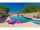 Large backyard pool and spa with ample room for seating and relaxation at 930 N Sandal Cir, Mesa, AZ 85205