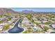 Expansive aerial view of the neighborhood with mountain views and a backyard pool at 9347 E Hillview Cir, Mesa, AZ 85207