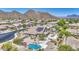 Residence with solar panels, pool, spa, and putting green, situated in a tranquil desert community with mountain views at 9347 E Hillview Cir, Mesa, AZ 85207
