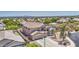Aerial view of a beautiful home showcasing a well-manicured yard, pool, and desert landscaping at 9347 E Hillview Cir, Mesa, AZ 85207