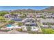 Stunning backyard retreat with pool, spa, patio, and putting green, perfect for relaxation and recreation at 9347 E Hillview Cir, Mesa, AZ 85207