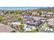 Expansive backyard with a sparkling pool, hot tub, and lush desert landscaping in a mountain view community at 9347 E Hillview Cir, Mesa, AZ 85207