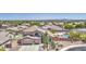 Aerial view of a beautiful home showcasing a well-manicured yard, pool, and desert landscaping at 9347 E Hillview Cir, Mesa, AZ 85207